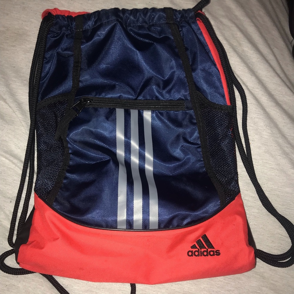 a pink and navy drawstring bag.